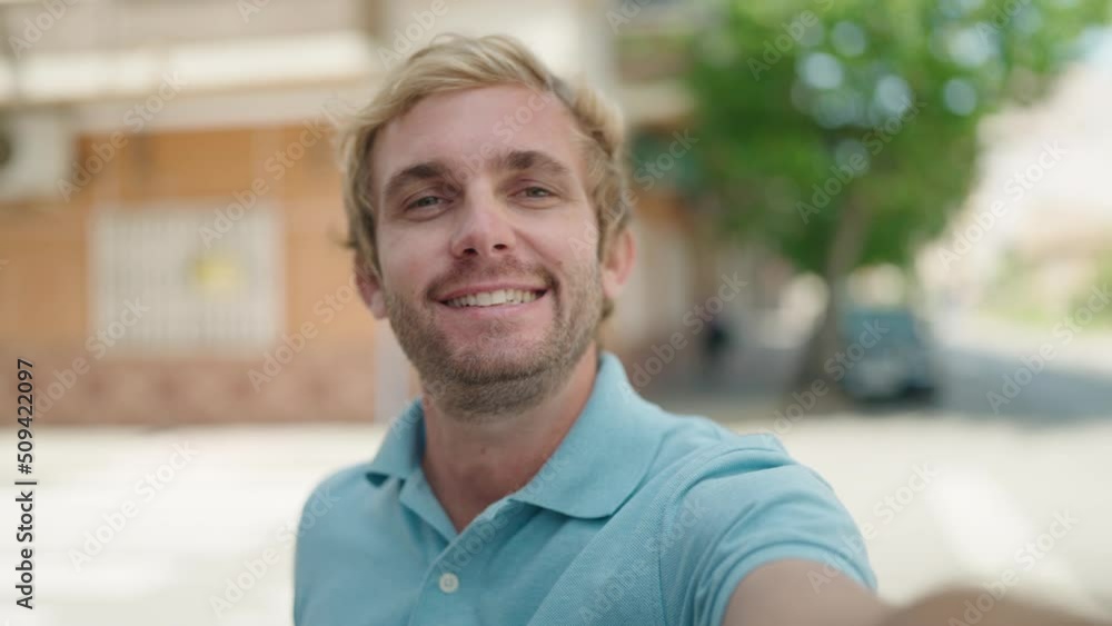 Young man smiling confident having video call at street Young man smiling confident having video call at street