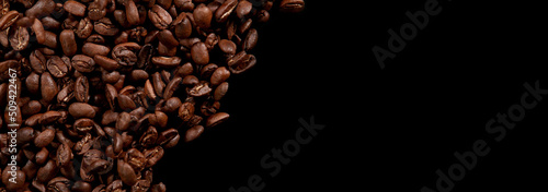 Coffee beans isolated on black background.