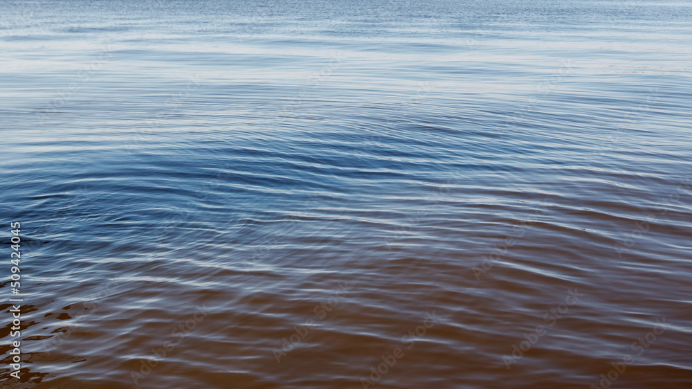 Naklejka premium Lightly wavy texture of the water surface of the lagoon.