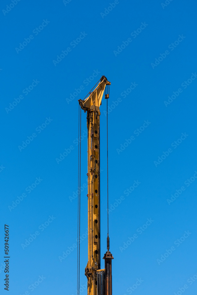 Industrial drilling machine at the construction site. Heavy duty machinery. Industrial drilling machine at the construction site. Heavy duty machinery.