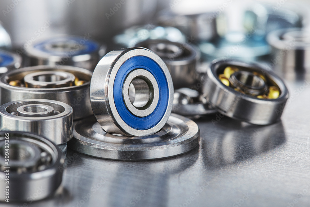 different bearings on a metal background. Part of mechanism. different bearings on a metal background. Part of mechanism.