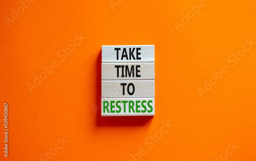 Take time to restress symbol. Concept words Take time to restress on wooden blocks. Beautiful orange table orange background. Psychological business and take time to restress concept. Copy space.