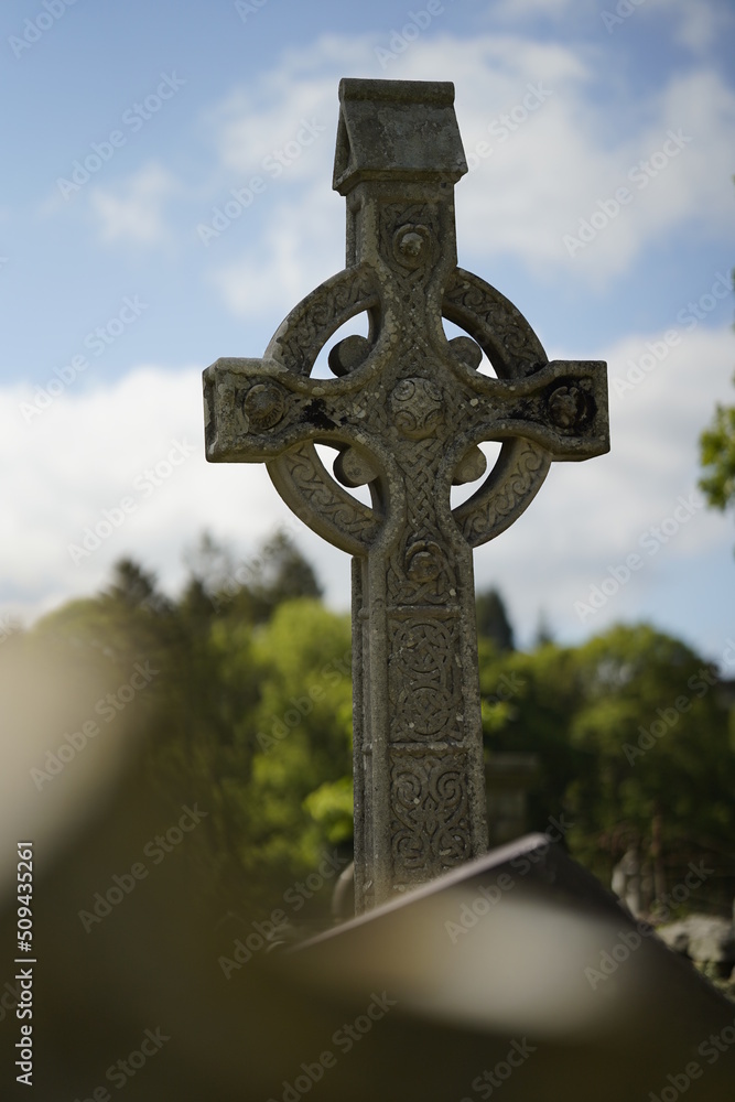 celtic cross on a cemetery 
