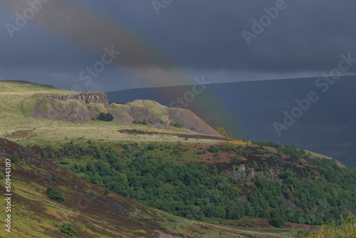 The slightest hint of a rainbow in between heavy rain showers photo