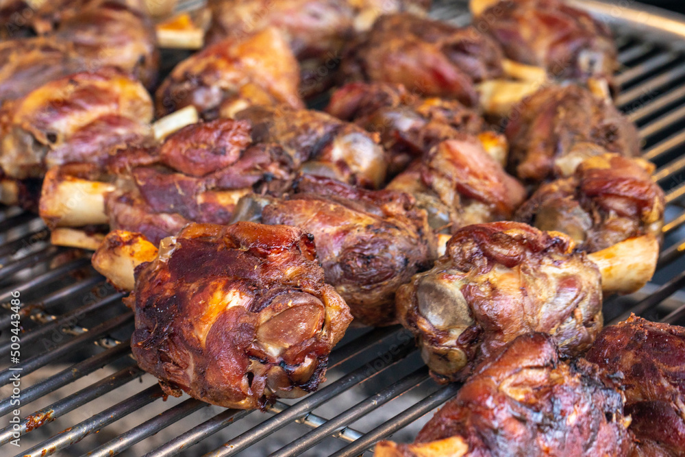 Pork shanks on the grill, closeup, outdoor picnic.
