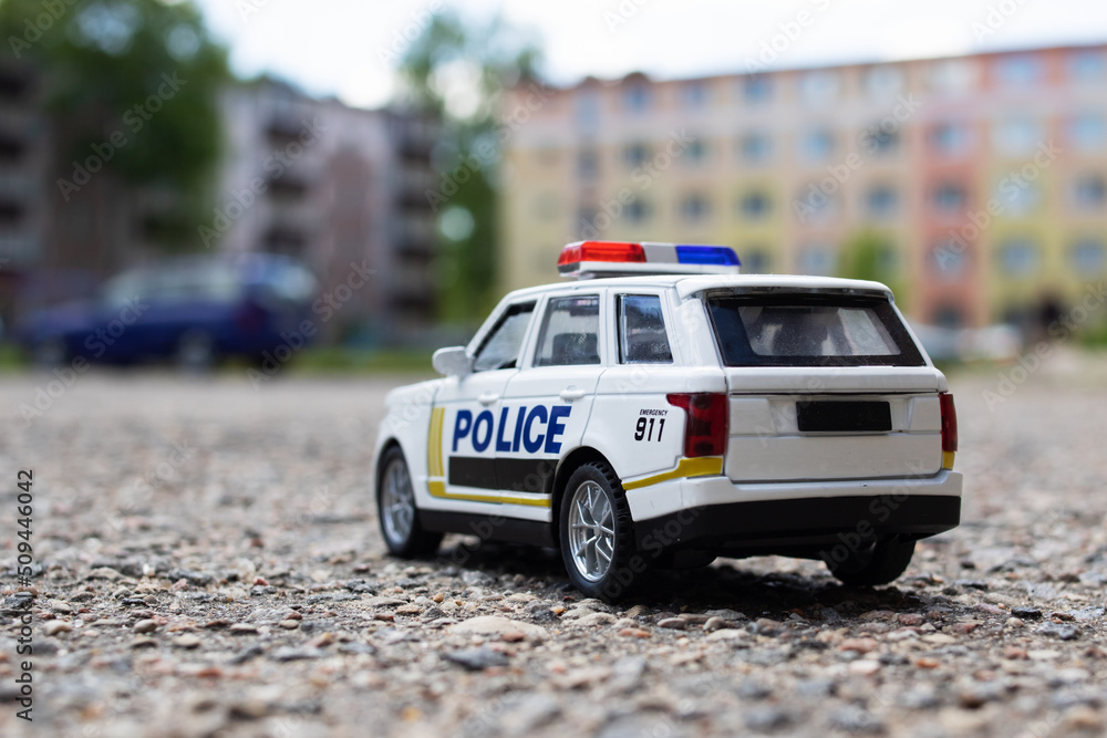 Police toy car on the street closeup Police toy car on the street closeup