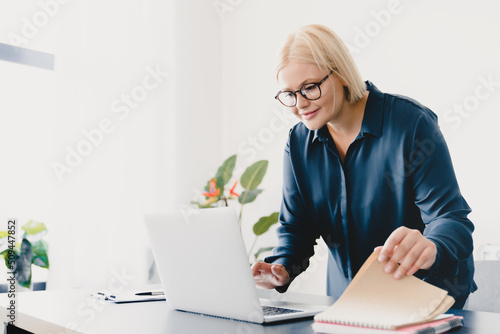 Smart caucasian young businesswoman ceo boss employee teacher freelancer working on laptop online, typing, e-learning, e-commerce, tutoring on distance remotely in office
