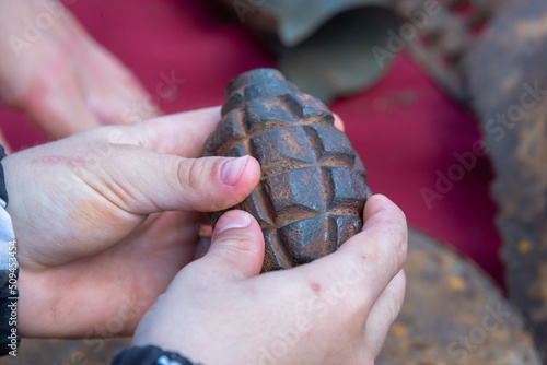 Grenade, explosives in the hands found during excavations.