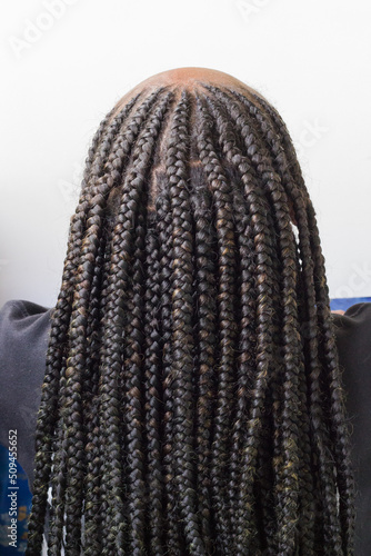 Young afro with  Boxer braids, African hair style also known as 