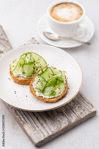 Keto Toasts with ricotta, egg, cucumber and black sesame.