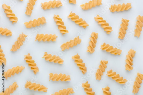 Pattern made of pasta on pastel background. Flat lay.