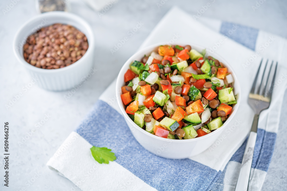 Lentil red bell pepper cucumber salad in a bowl Lentil red bell pepper cucumber salad in a bowl
