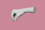 Female hand makes a gesture like holding something isolated on a pink background. Mockup with empty copy space for a hanging object. Trendy modern 3d collage in magazine style. Contemporary art