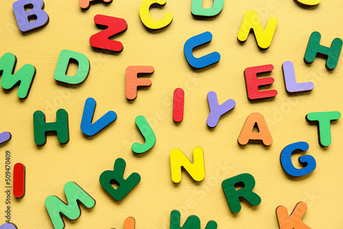 Colorful letters on yellow background. Alphabet concept