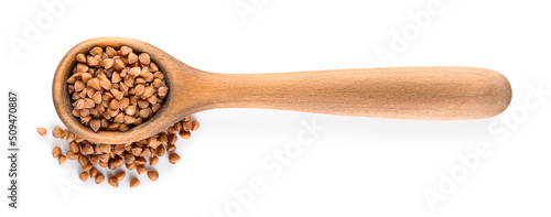 Wooden spoon with buckwheat on white background