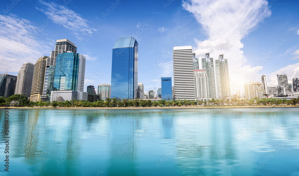 Fototapeta premium View of city landscape reflection on the river. selective focus