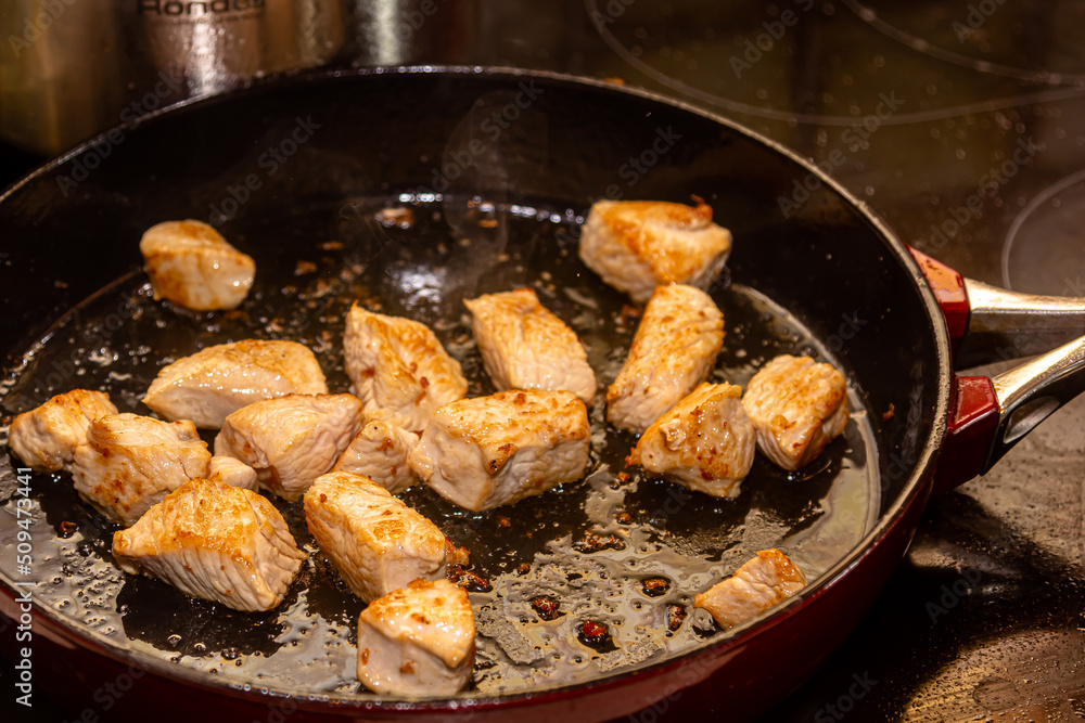 turkey fillet pieces frying on nonstick pan turkey fillet pieces frying on nonstick pan