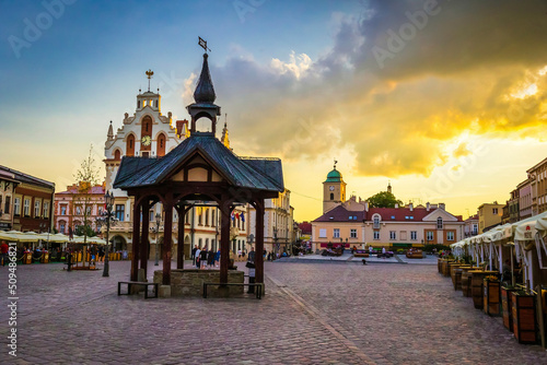 The municipal market in Rzeszów - Poland. Church of St. Adalbert and St. Stanislaus and city streets of Rzeszow - Poland photo