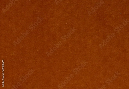 Full frame image of textured dark orange velvet with copy space