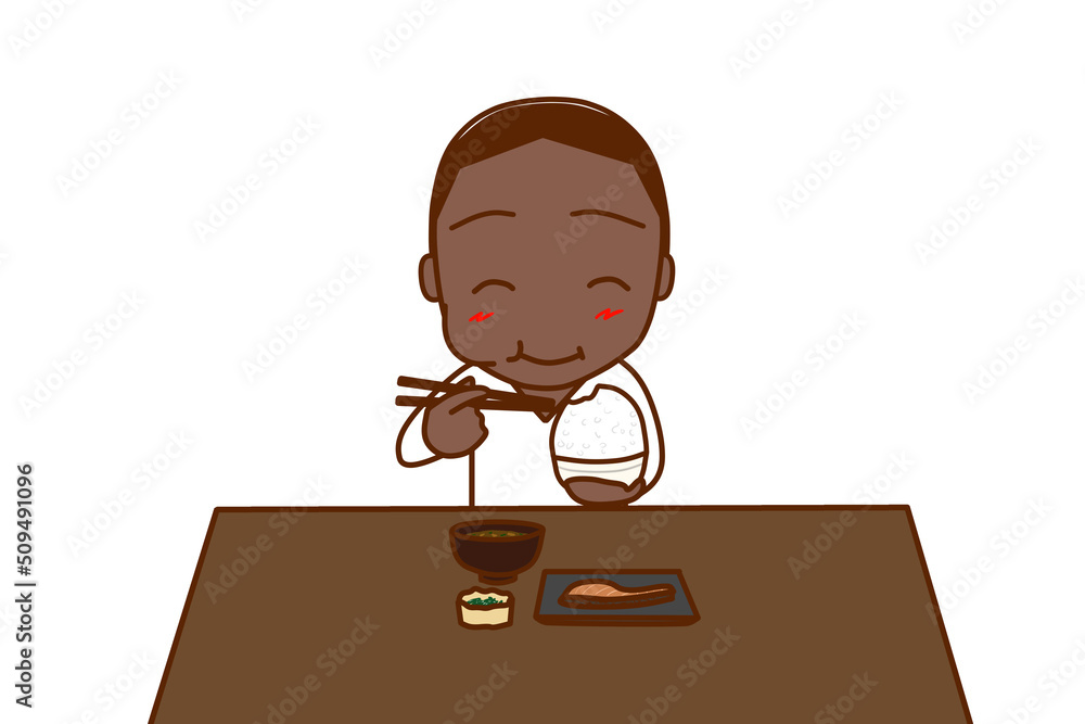 （正面）大盛のご飯と和食を食卓で笑顔になって食べるアフリカ系男性