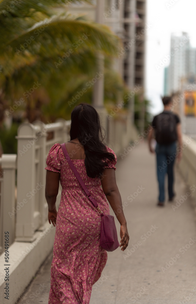 woman  walking in the city people bridge Brickell miami 