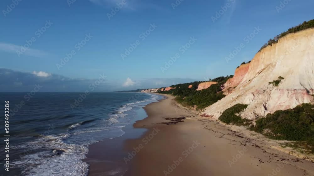 Beautiful and high nature cliffs of bahia in front of the beach - aerial Drone View - Arraial D'Ajuda, Porto Seguro, Bahia - Atlantic Forest Beautiful and high nature cliffs of bahia in front of the beach - aerial Drone View - Arraial D'Ajuda, Porto Seguro, Bahia - Atlantic Forest