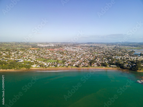 Spectacular beachfront properties seen aerially from the sky by drone in Red beach, New Zealand 