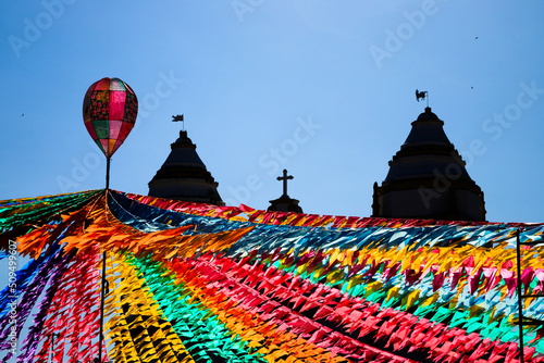 decoração junina - igreja em silhueta com bandeirinhas coloridas e balão decorativo photo