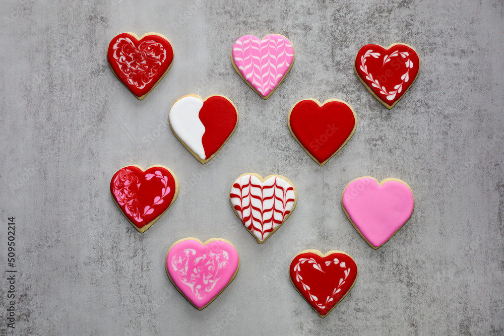 Heart shaped sugar cookies decorated with different designs with royal icing  for valentine's day.