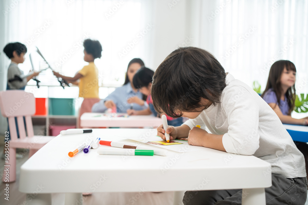 Mixed race Group of young children student playing together in school. Mixed race Group of young children student playing together in school.