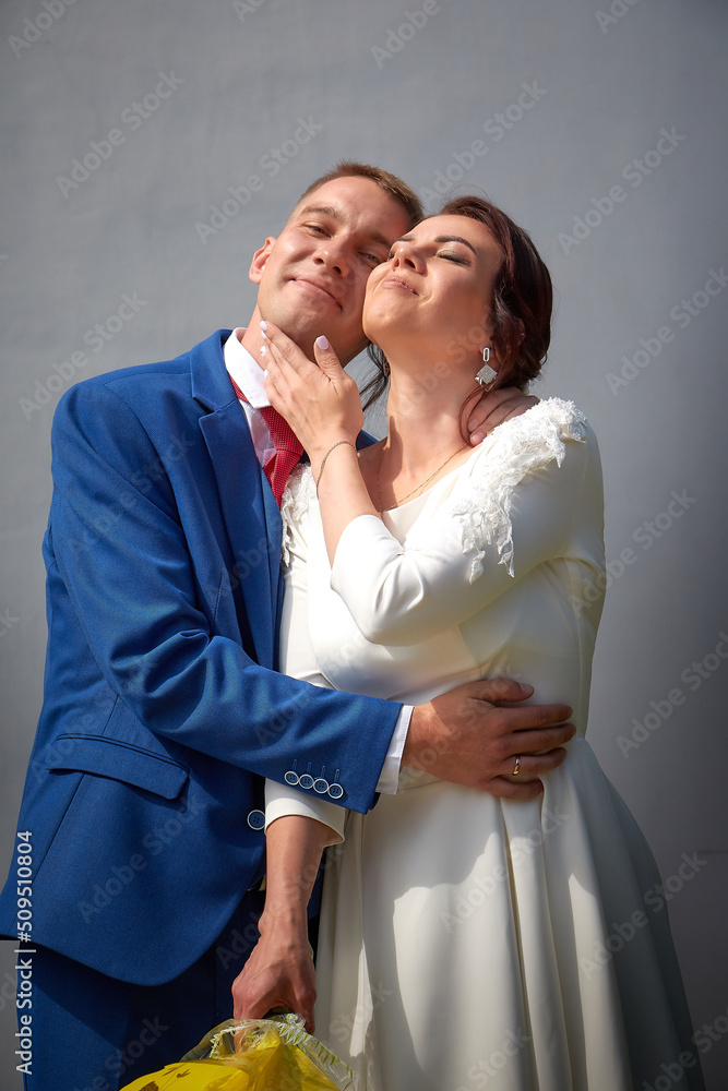 The bride and groom during beautiful marriage ceremony at the registry office in Russia. The concept of love and family
