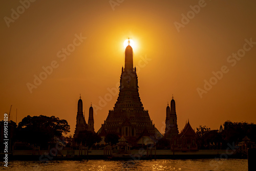 Scenery of sunset behind the top of pagoda  Temple of Dawn   Wat Arun  Bangkok  Thailand.
