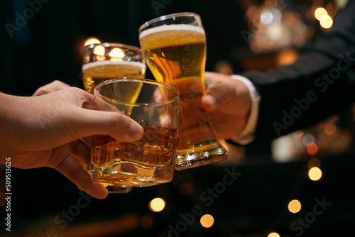 Fototapeta Celebrate whiskey on a friendly party in  restaurant