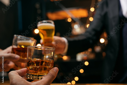 Obraz na płótnie Celebrate whiskey on a friendly party in  restaurant