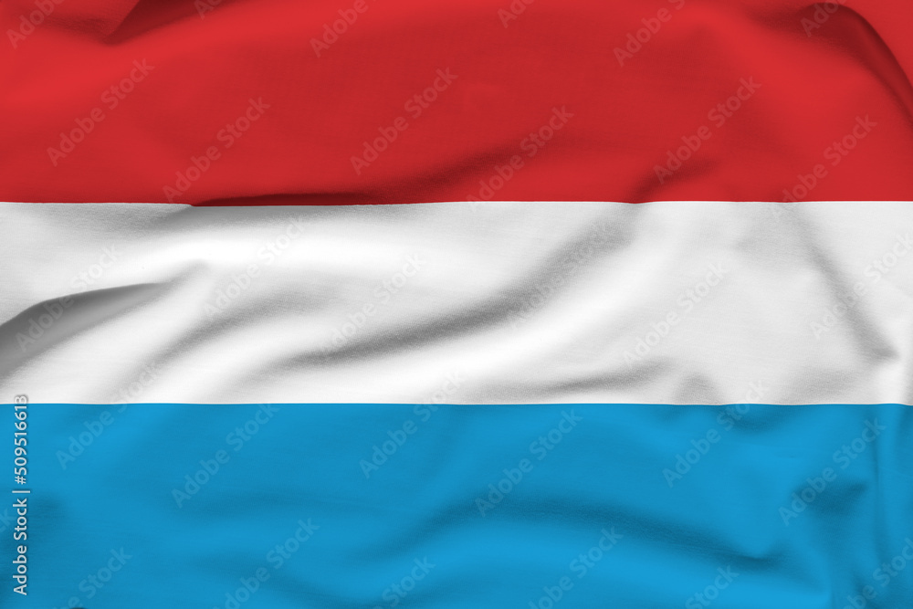Luxembourg national flag, folds and hard shadows on the canvas Luxembourg national flag, folds and hard shadows on the canvas