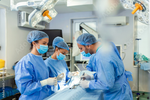 Concentrated Surgical team operating a patient in an operation theater. Well-trained anesthesiologist with years of training with complex machines follows the patient throughout the surgery.
