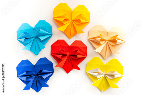 colored hearts made of paper on a white background. love concept