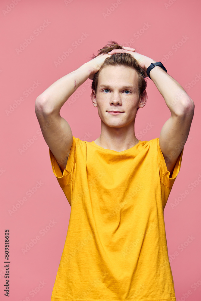 guy in a yellow shirt posing with his hands on his head guy in a yellow shirt posing with his hands on his head