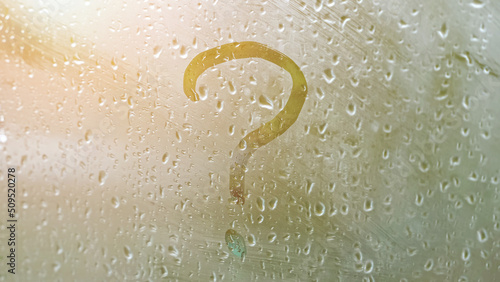 Φωτογραφία Question mark on misted window glass, closeup