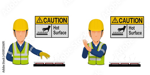 A worker with hot surface warning sign