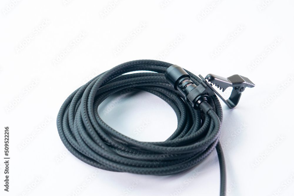 clip on microphone with braided cable isolated on white background clip on microphone with braided cable isolated on white background