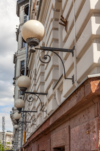 Moscow, Russia, June 4, 2022. Beautiful street lamps at facade of historical building