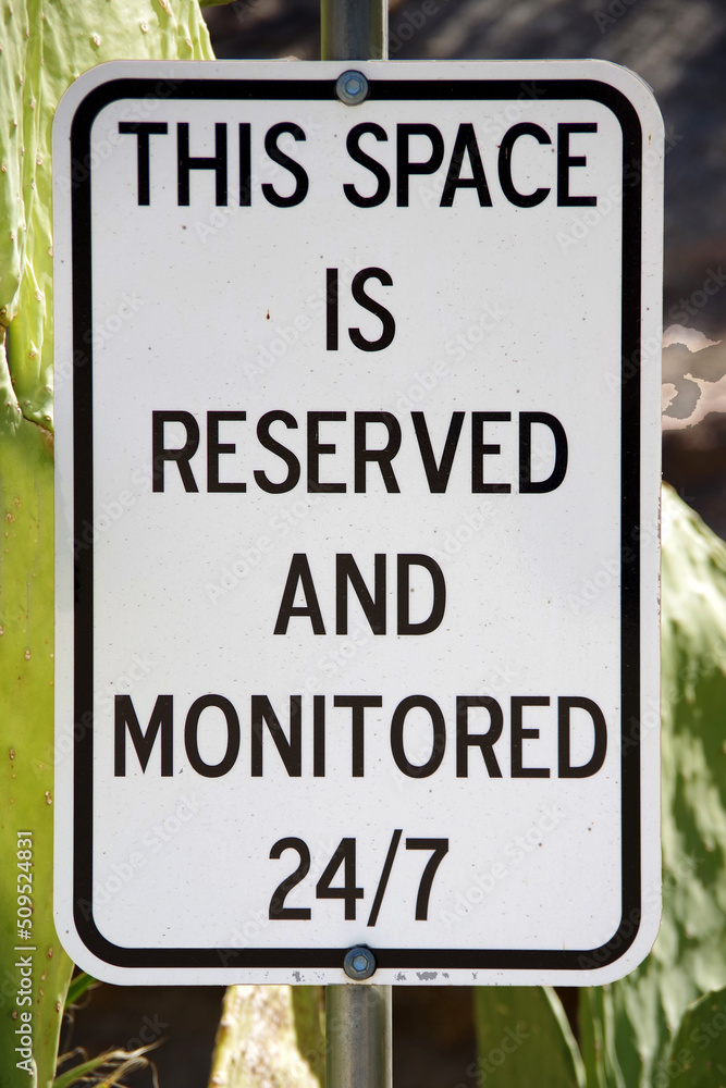 Parking spot sign THIS SPACE IS RESERVED AND MONITORED Parking spot sign THIS SPACE IS RESERVED AND MONITORED