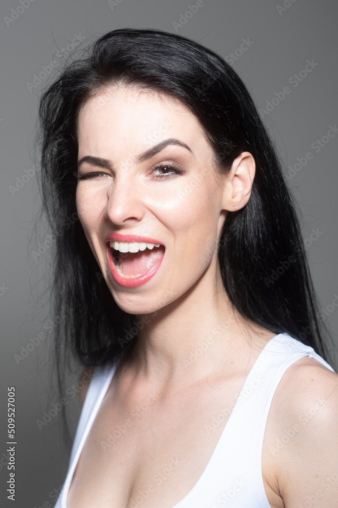 Woman winks. Girl with questioning gesture. Girl shrugging shoulders, doubts. Woman winks. Girl with questioning gesture. Girl shrugging shoulders, doubts.