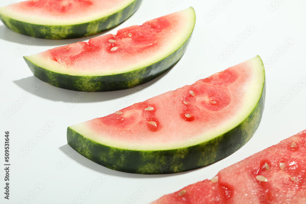 Slices of fresh watermelon on white background