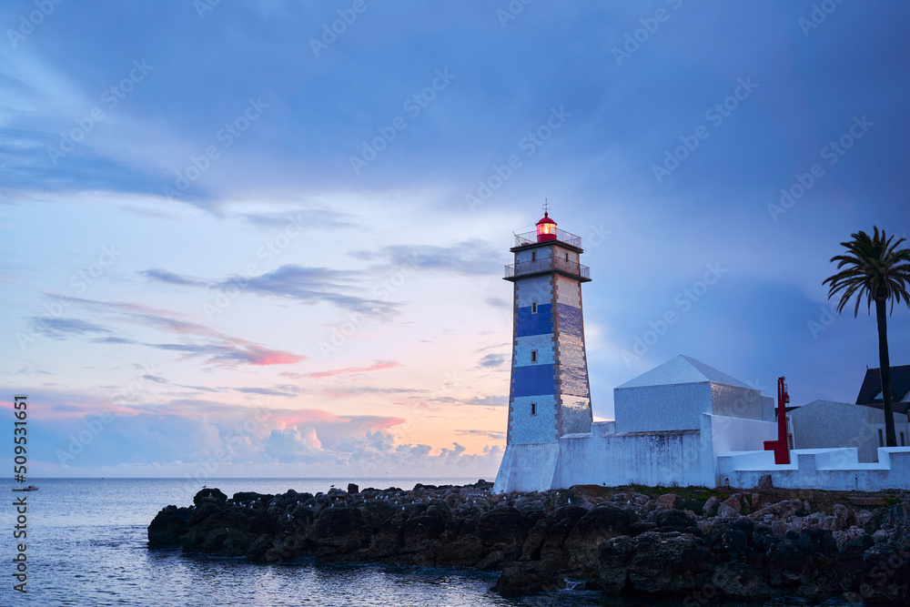 Farol Museu de Santa Marta. Lighthouse and Museum in Cascais, Portugal. Beautiful sunset on the sea shore.