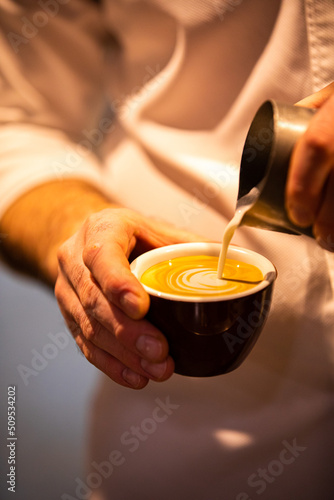 Pouring latte milk