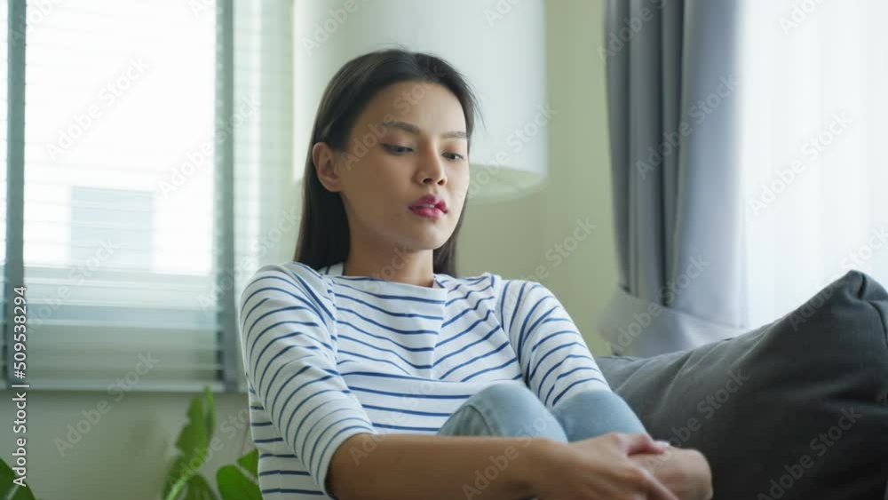 Asian beautiful upset depressed girl sitting alone on bed in bedroom. Asian beautiful upset depressed girl sitting alone on bed in bedroom.