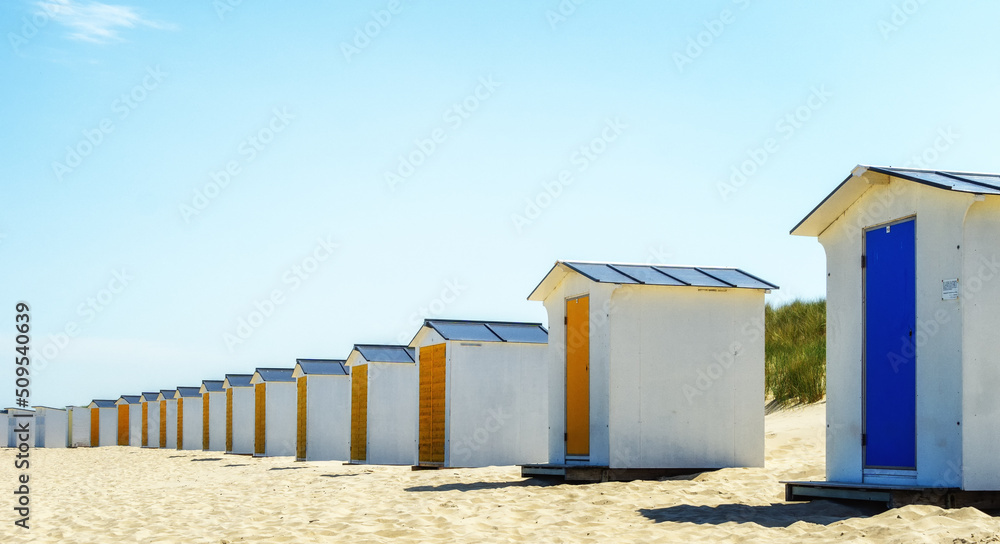 Lonely colorful beach lockers on a Dutch beach