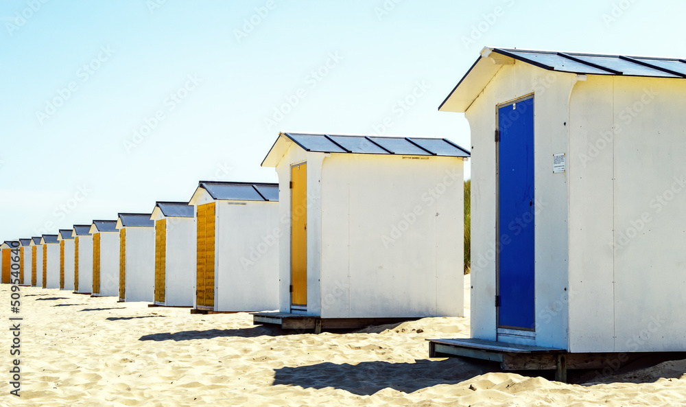 Lonely colorful beach lockers on a Dutch beach Lonely colorful beach lockers on a Dutch beach